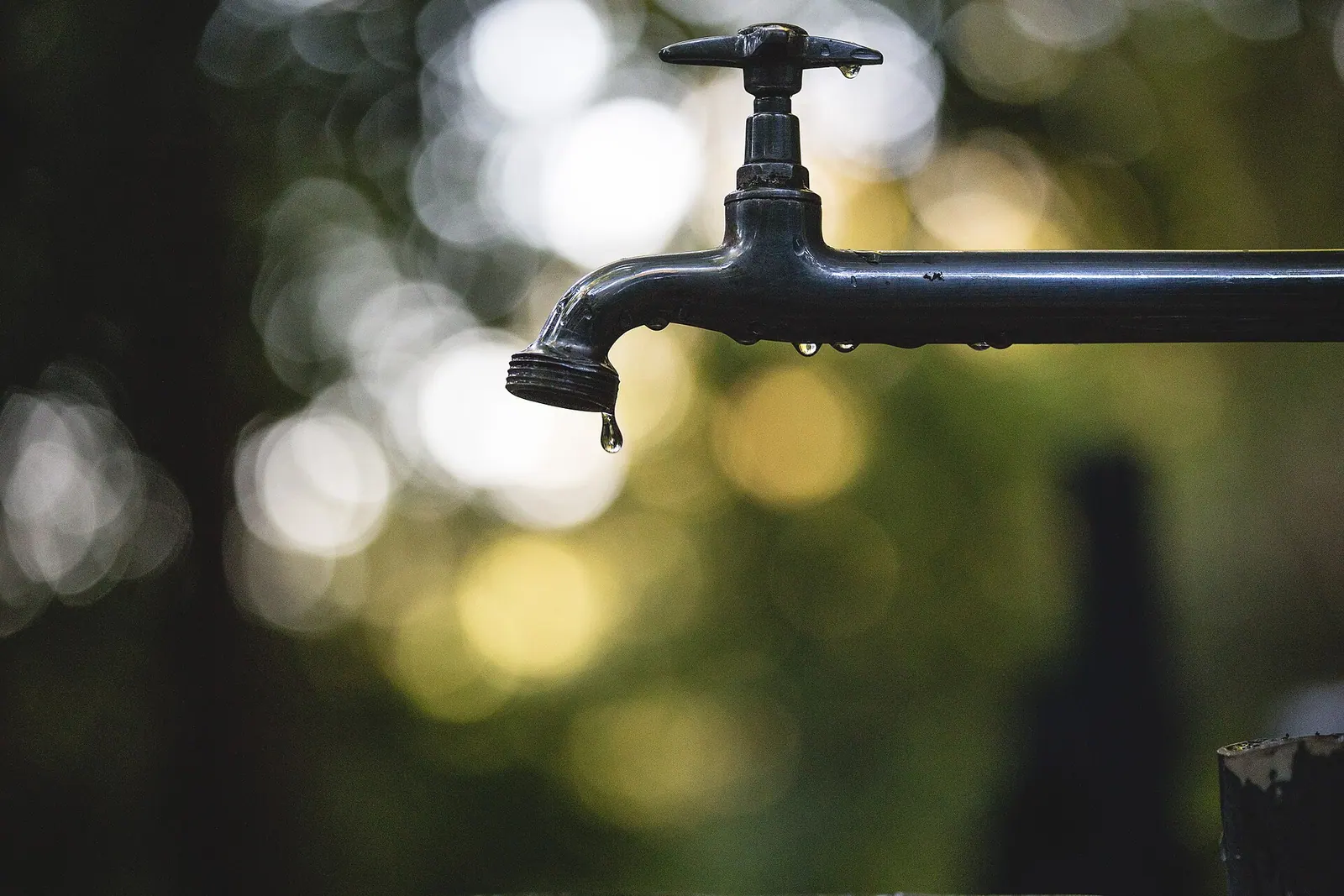 Close-up of a dripping outdoor tap